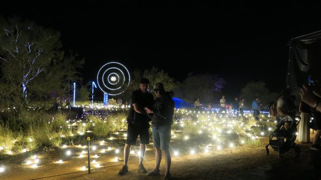 Attendees explore the light show at Alice Springs Desert Park on Saturday night.