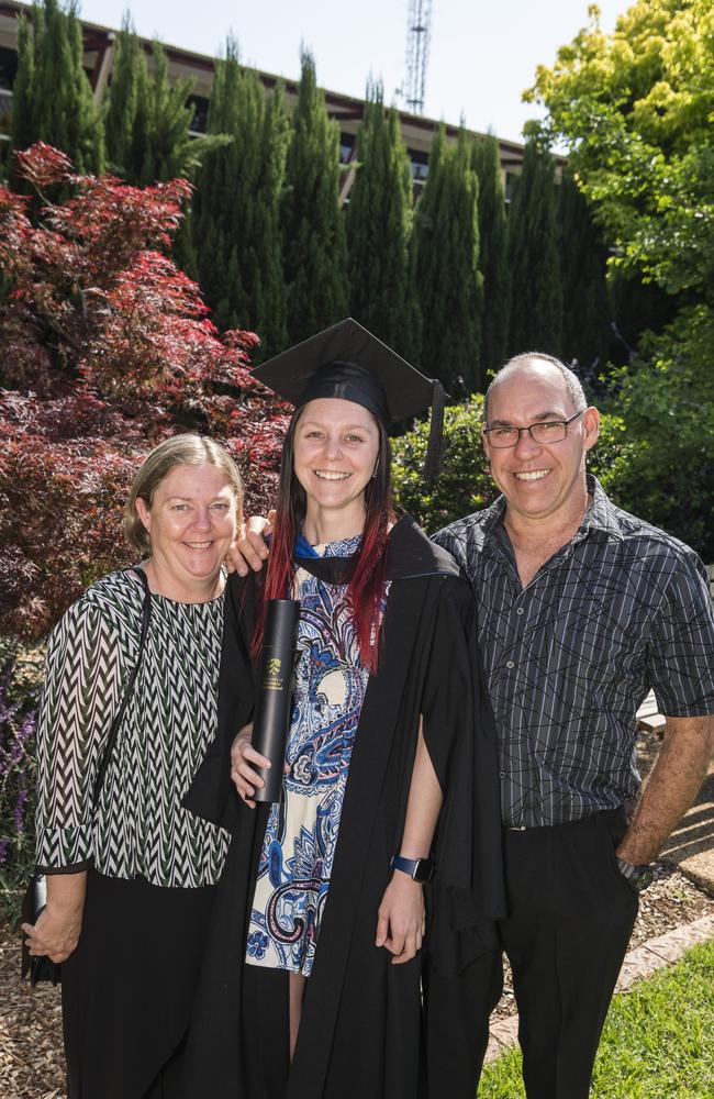 Bachelor of Nursing graduate Emily Burgon with parents Sue and Les Burgon at a UniSQ graduation ceremony at Empire Theatres, Tuesday, October 31, 2023. Picture: Kevin Farmer