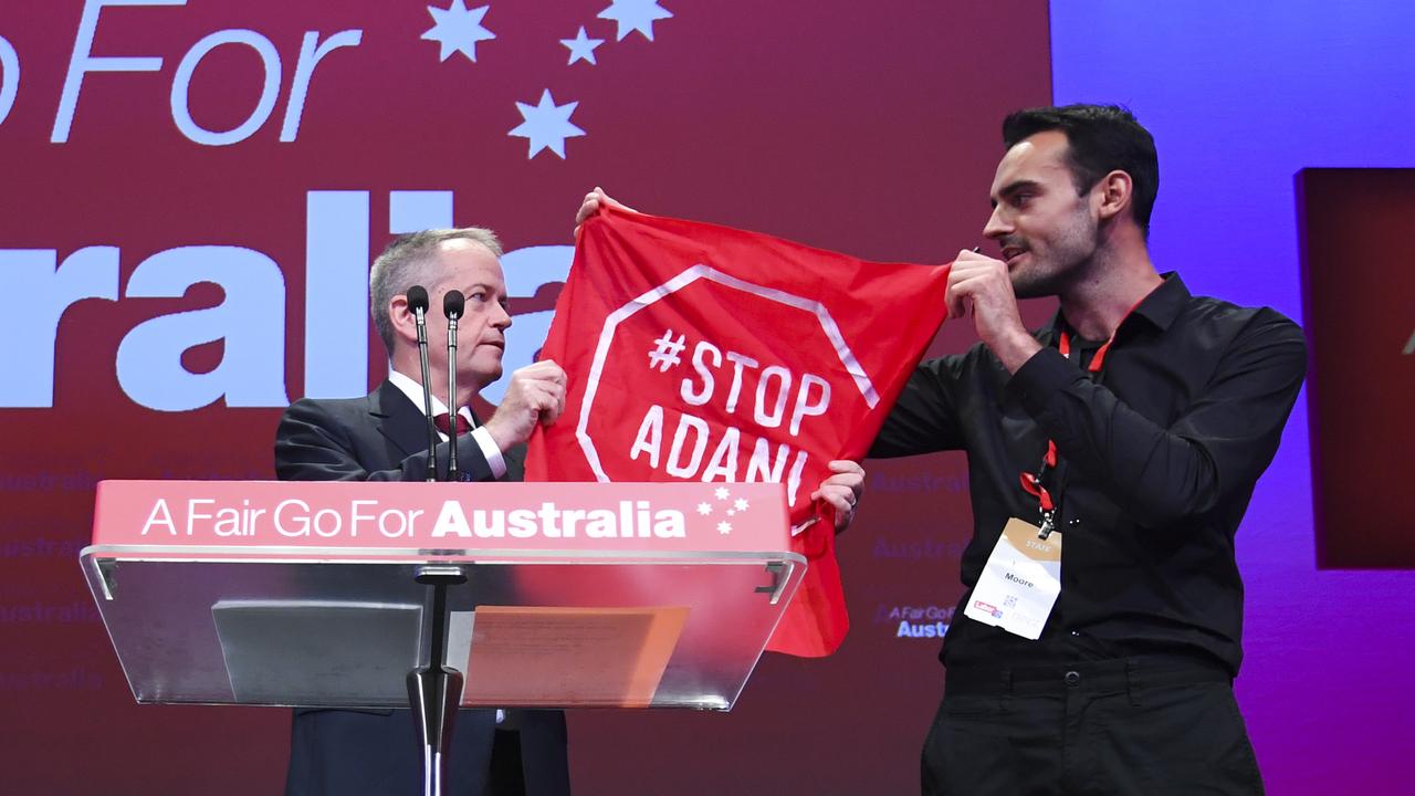 Bill tries to take the flag away. Picture: Lukas Coch/AAP