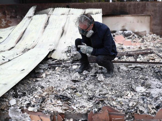 British actor and audiobook narrator Simon Vance searches through the remains of his studio at his home which burned in the Eaton Fire on January 25, 2025 in Altadena, California. Picture: Getty Images via AFP