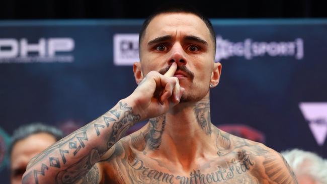 George Kambosos Jr poses on the scale during weigh-in. (Picture: Kelly Defina/Getty Images