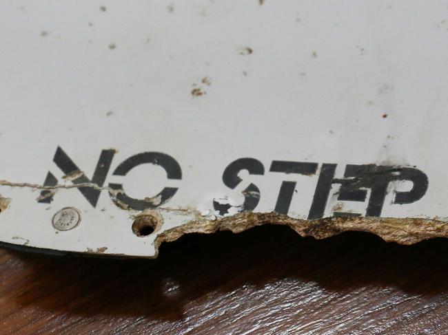 (FILES) This file photo taken on March 3, 2016 shows a piece of suspected aircraft wreckage found off the east African coast of Mozambique at Mozambique's Civil Aviation Institute (IACM) in Maputo. Two pieces of debris found in Mozambique are "almost certainly from MH370", Australia's transport minister said on March 24, 2016, following analysis by technical specialists probing the missing Malaysia Airlines flight. / AFP PHOTO / ADRIEN BARBIER