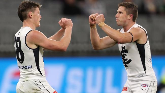 PERTH, AUSTRALIA - AUGUST 15: Sam Walsh and Marc Murphy of the Blues celebrate a goal during the round 12 AFL match between the Fremantle Dockers and the Carlton Blues at Optus Stadium on August 15, 2020 in Perth, Australia. (Photo by Paul Kane/Getty Images)