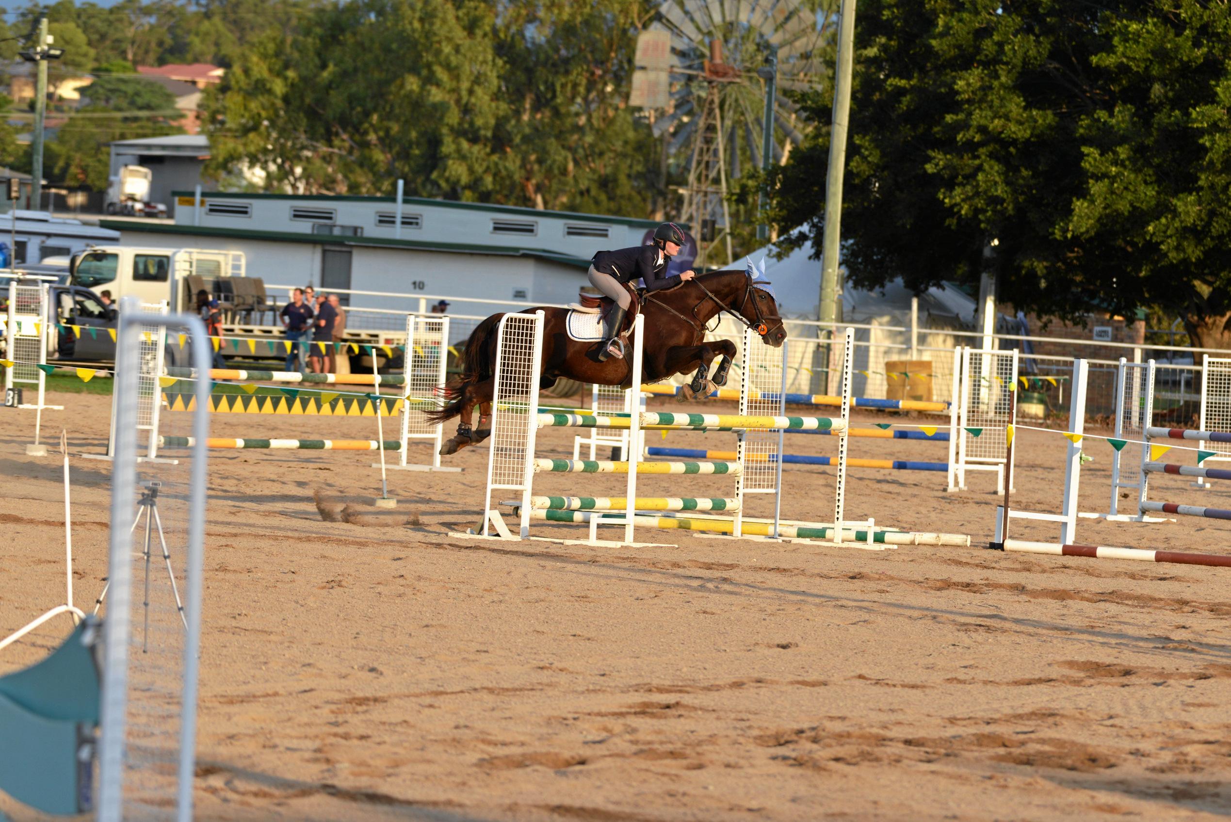 Emmy Ravenscroft wins the Country Children's Championship showjumping for riders 14 years and under at the Warwick Show. Picture: Gerard Walsh