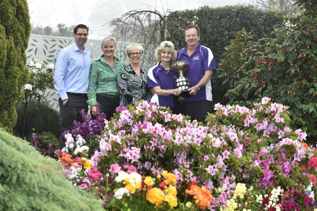 GARDEN CHAMPIONS: Bob and Val Ford (right) in their Burke St garden after being announced the Chronicle Garden Competition grand champions for 2015 with representatives from the council, Heritage Bank and The Chronicle. . Picture: Bev Lacey