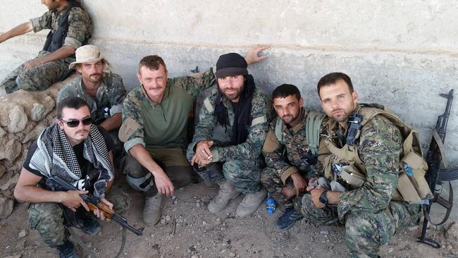 Reece Harding with his unit in Syria. On the far left is Ashley Dyball and, on the far right, Robert Alleva.