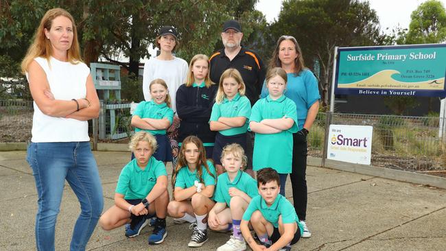 Surfside Primary School council president Eloise Cann, left, and parents Stefanie Henderson, vice president Erik Wirtz and Sabrina Lunn with students, is calling for updated and additional school facilities. Picture: Alison Wynd