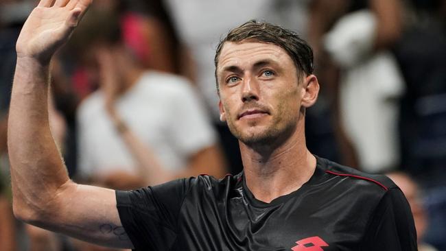 Australia's John Millman celebrates his stunning win over Roger Federer.