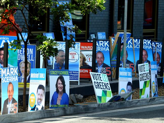 Council candidate signage at the Helensvale Library pre polling venue Pic by David Clark