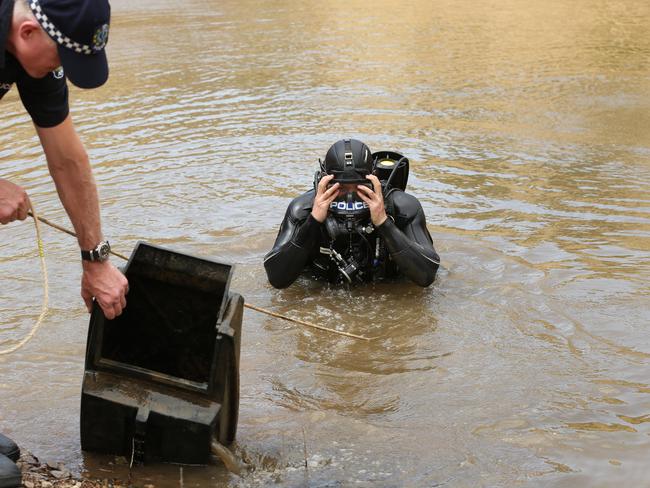 Police divers search a nearby dam. Pic Tait Schmaal