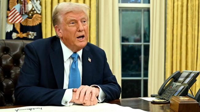 US President Donald Trump speaks to the press after signing an executive order in the Oval Office of the White House in Washington, DC on January 31, 2025. (Photo by Mandel NGAN / AFP)