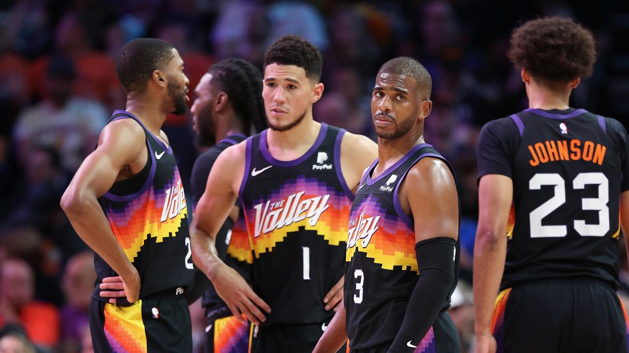 Chris Paul of the Phoenix Suns stands on the court with Mikal Bridges, Devin Booker and Cameron Johnson during the 2022 play-offs. Photo by Christian Petersen/Getty Images.