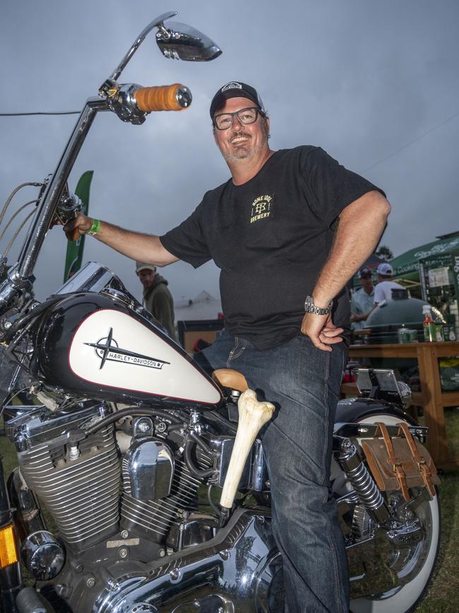 Alister Ferguson with his 1998 Harley Davidson Dyna Wide Glide complete with animal bone gearshifter at Meatstock, Toowoomba Showgrounds. Saturday, April 9, 2022. Picture: Nev Madsen.