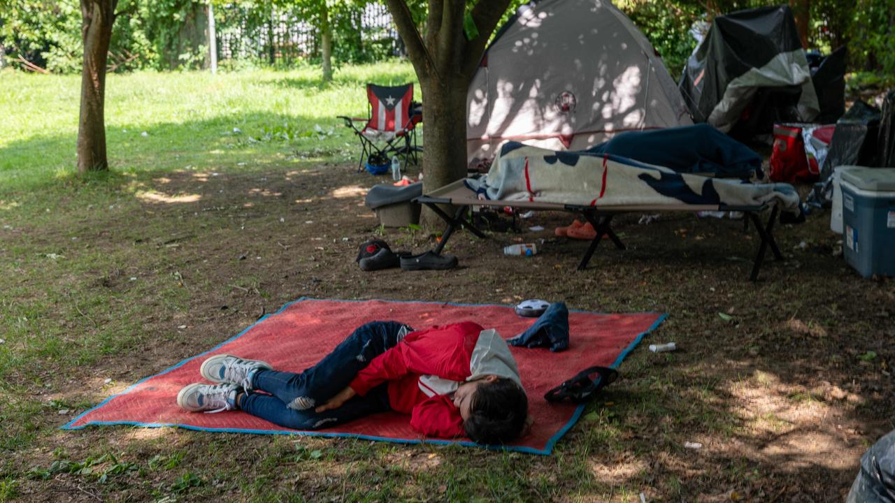 Migrants are living outside on Randall's Island after leaving the shelter. Picture: Spencer Platt/Getty Images/AFP