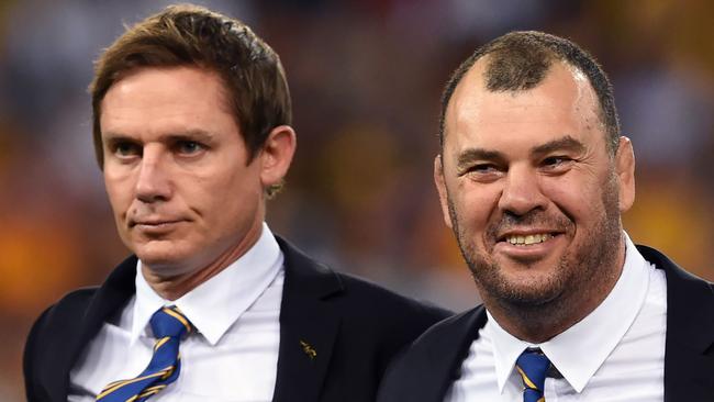 Stephen Larkham, left, as an assistant to departing Wallabies boss Michael Cheika. Picture: AFP