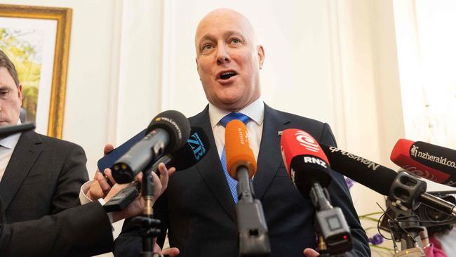 New Zealand's new Prime Minister Christopher Luxon speaks to the media during the swearing-in of the new government on Monday. Picture: Marty Melville AFP