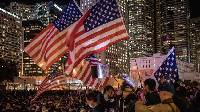 Pro-democracy protesters take part in a Thanksgiving Day rally at Edinburgh Place in Hong Kong. Protesters gathered to say thank you to the United States after US President Donald Trump signed legislation supporting the Hong Kong pro-democracy protesters. Picture: Getty Images