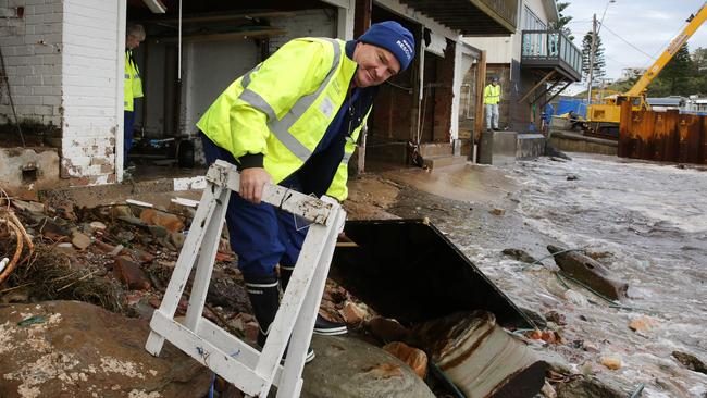 Mariner Rescue Terrigal Controller Cameron Sloey starts the massive clean-up after the weekend's storm, driven by an Eastern Coast Low, caused extensive damage to its headquarters at The Haven. Picture: Mark Scott