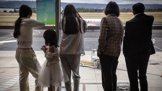 ADELAIDE, SOUTH AUSTRALIA - Advertiser Photos NOVEMBER 28, 2024: FILE image of people inside Adelaide Airport looking out at a Jetstar plane. Picture Emma Brasier