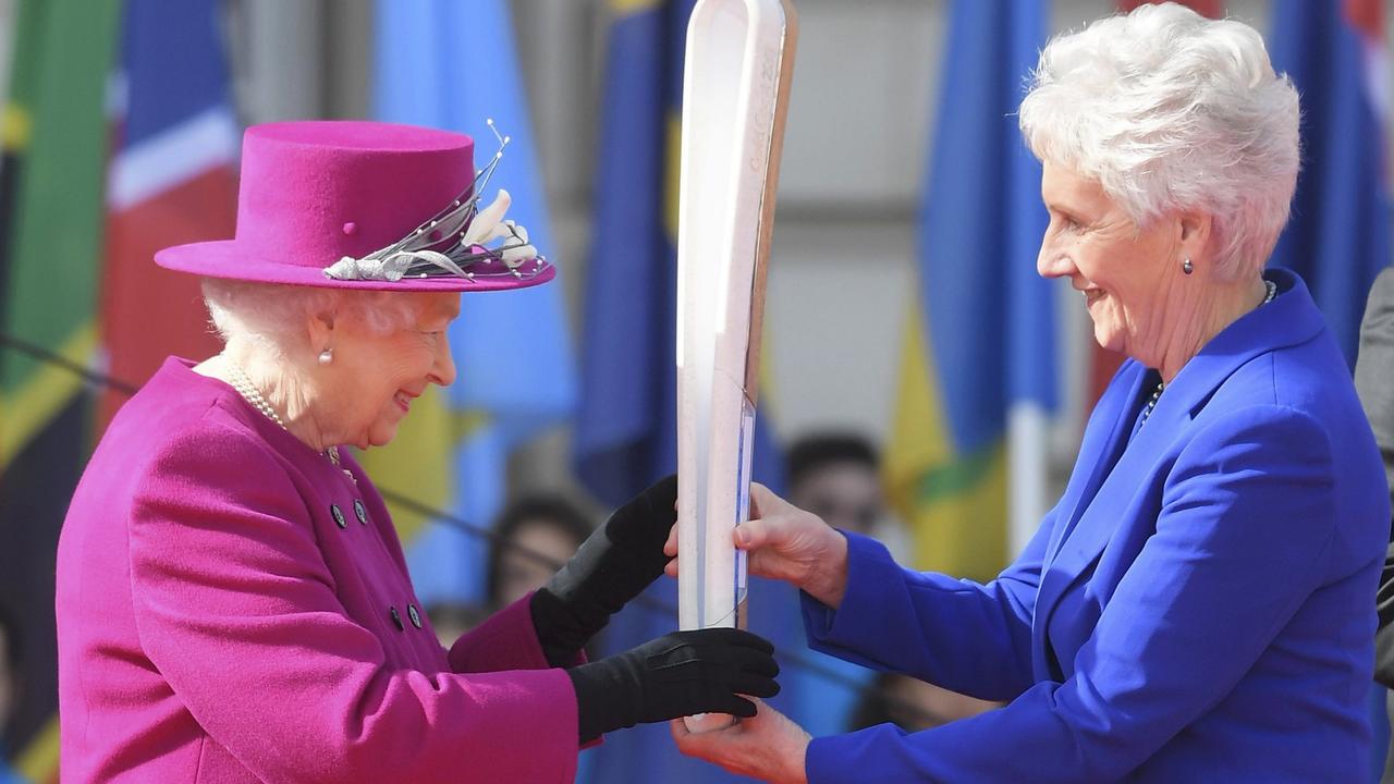 Queen Elizabeth receives the baton from Louise Martin of the Commonwealth Games organizing committee during the launch of The Queen's Baton Relay for the XXI Commonwealth Games being held on the Gold Coast in 2018 at Buckingham Palace on March 13, 2017 in London, United Kingdom. Picture: Toby Melville - WPA Pool/Getty Images