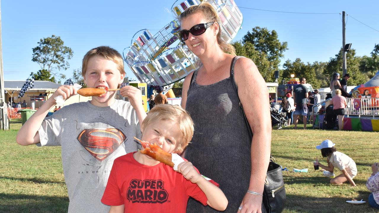 Mark, Talon, and Abi Kampf of Jubilee Pocket enjoying a bite to eat at Show Whitsunday. Picture: Kirra Grimes