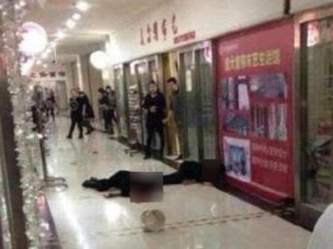 Shocked onlookers at the bloody scene of the attack.