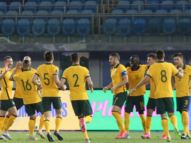 The Socceroos celebrate Mathew Leckie’s first-minute goal. Picture: Yasser Al-Zayyat/AFP