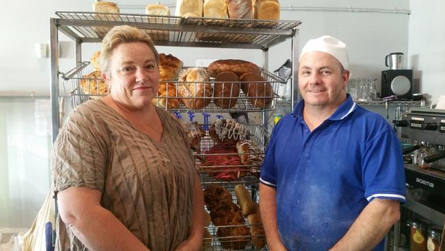 Upper Murray Community Bakery's baker Peter Grogan with Corryong Neighbourhood Centre co-ordinator Sara Jenkins. Ms Jenkins said the cumulative effect of natural disaster and Covid-19 has strained community organisations in recent years.