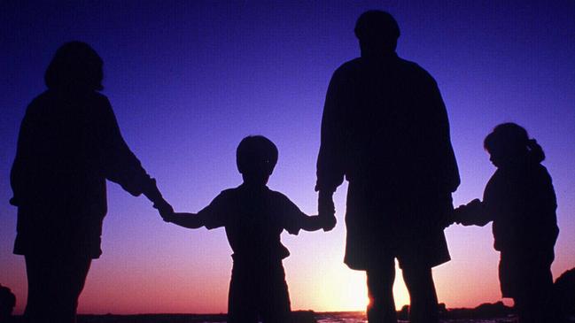 Silhouette of family at beach.  children parents parent child/Family