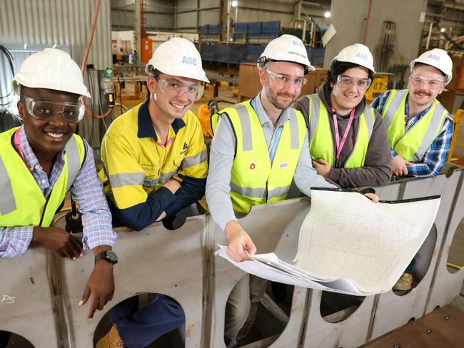 Luerssen and ASC scholarship recipients Daniel Bigirimana, Jackson Preus, Andrew Penny, Alec Rusanoff and Kane O’Brien at the Osborne Naval Shipyard OPV construction site .