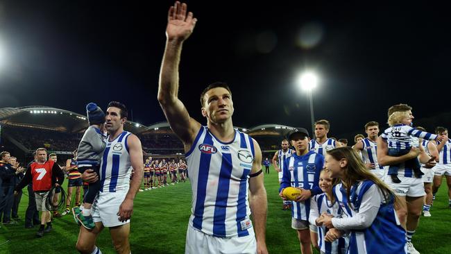 Brent Harvey walks off after playing his last match for North Melbourne.