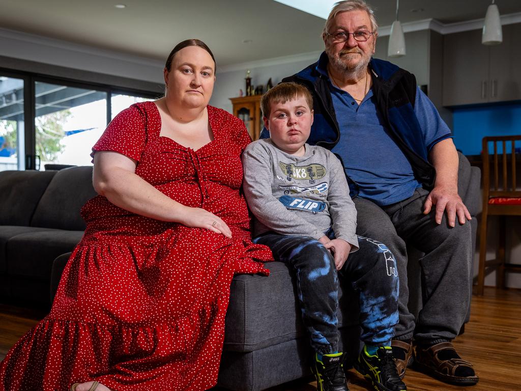 Jayden with his mother Monica and grandfather Michael. Picture: Jake Nowakowski