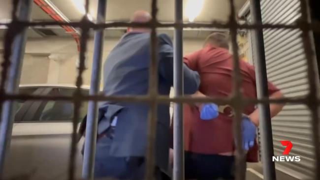 The man accused of shooting and woman and her daughter at Campbelltown is taken into custody. Picture: 7NEWS