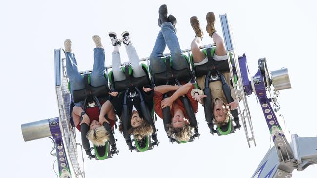 HOLD ON: Clint 14 and Leo 20 ride The Joker with Reporters Natalie and Jess. Picture: Brett Hartwig