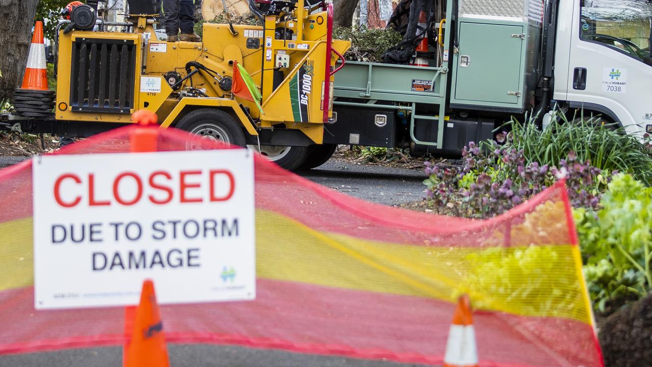 Council workers clean up St Davids Park after a previous severe weather event, with the council today announcing it’s pre-emptively closing the park down with more wild conditions on the way. Picture: Richard Jupe