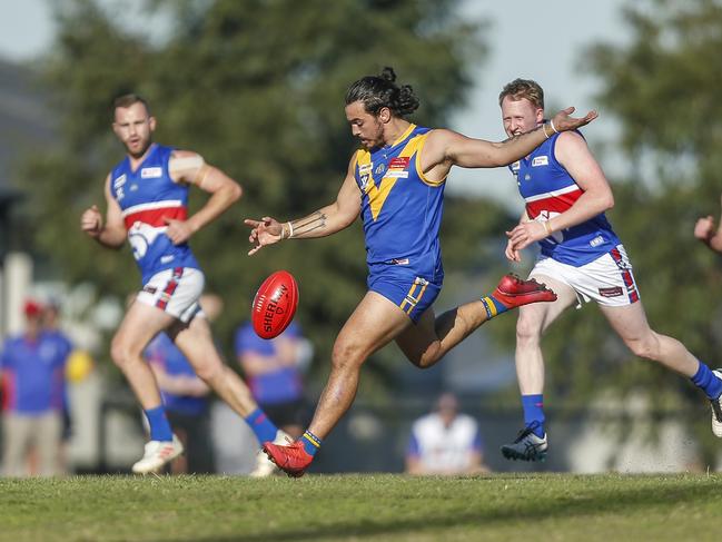 Nicholas Russo sends Cranbourne into attack. Picture: Valeriu Campan