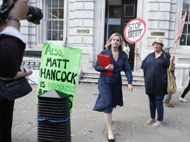 Amber Rudd, Secretary of State for Work and Pensions, Minister for Women and Equalities leaves the Cabinet office past some anti-Brexit protesters in London. Picture: AP