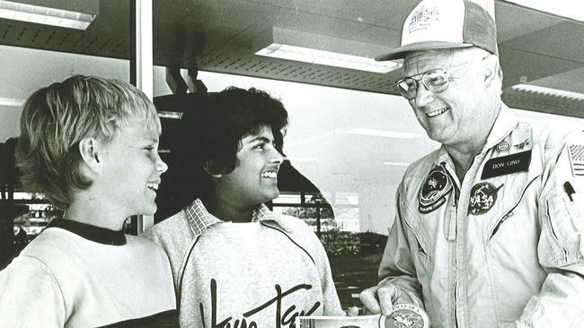 NASA astronaut Dr Don Lind hands autographed photos to Penny Williams and Katrina Mohamed during a trip to Bundaberg in 1985 where he presented the third Hinkler Memorial lecture. His appreciation gift was a 12cm wooden rib from one of Hinkler's hand-made gliders. Dr Lind gave the relic to Challenger commander Dick Scobee, who took it with him on his ill-fated final Challenger mission. The relic was recovered from the sea after the space shuttle's explosion and was returned to the Hinkler Memorial Museum. Photo: NewsMail