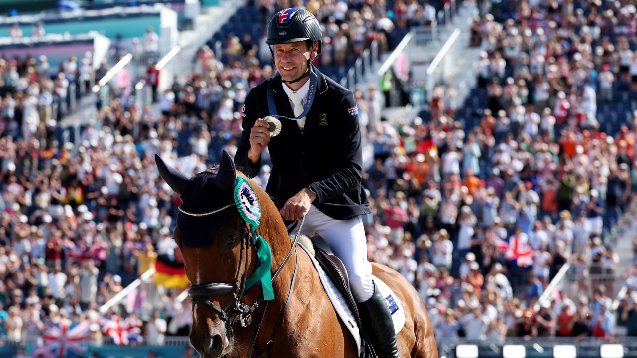 Paris 2024 silver medallist Christopher Burton with horse Shadow Man of Team Australia celebrate during a lap of honour after the medal ceremony for the Eventing Jumping Individual Final. (Photo by Kevin C. Cox/Getty Images)