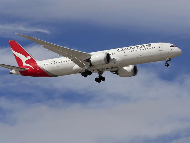 SYDNEY, AUSTRALIA - MARCH 10: A Qantas Airways jet lands at Sydney Airport on March 10, 2020 in Sydney, Australia. Qantas has cut almost a quarter of its international capacity for the next six months as travel demands fall due to fears over COVID-19. The airline today announced it was altering routes to London and would be parking eight of their 12 A380 aircraft. (Photo by Mark Evans/Getty Images)