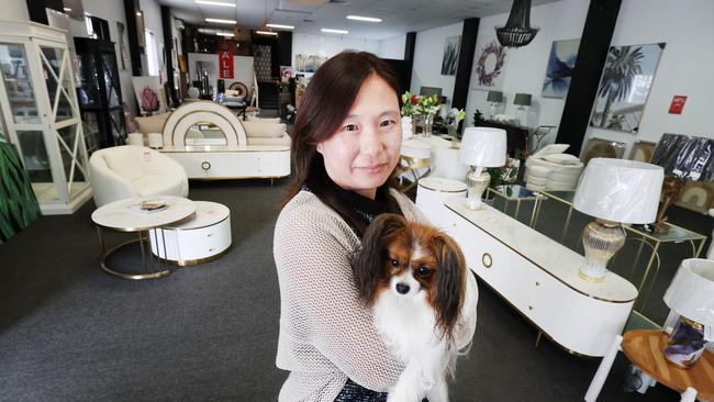 Found on Ferry is closing down after 12 years due to cash flow crisis. Owner Winnie Chin and her dog Lolly inside the store for one last sale where everything must go. Picture Glenn Hampson