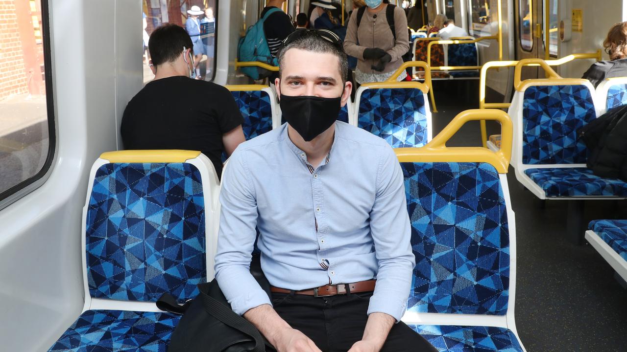 City worker Kostya Kuzmenko commutes on the train. Picture: David Crosling