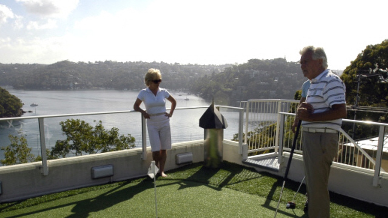 Bob Hawke (R) and wife Blanche d'Alpuget on the golf putting green he had installed on top of his home. Picture: Dennis Rutzou Public Relations