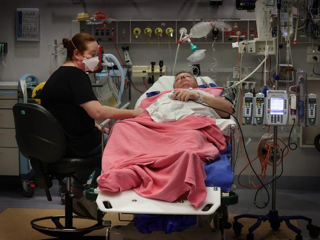 Patient Craig Wallace is comforted by his wife in a trauma room after a motorcycle crash. Picture: David Caird