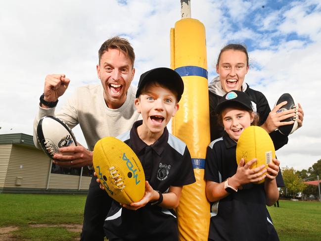 The new partnership between the Resilience Project and Coles is arming kids in regional and remote schools Collingwood WAFL player Jordan Allen and Hugh Van Cuylenburg with Shepparton East primary school students Alex and Lexi. Picture: Rob Leeson