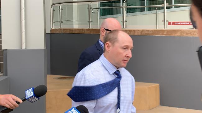 Former high school teacher Nathan Neil Ramm, 39, leaves Rockhampton courthouse after being sentenced to 18 months prison, wholly suspended and operational for three years, along with 18 months probation for charges of distributing and possessing child porn.