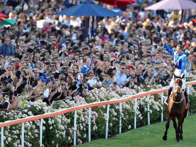 Hugh Bowman celebrates on Winx after her record-equalling win. Picture: Alex Coppel.