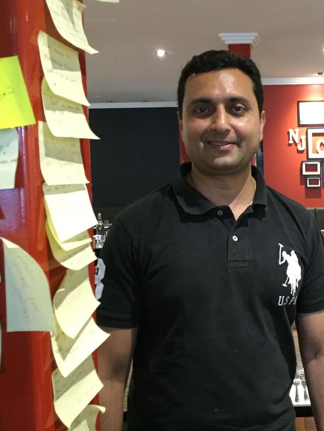 Co-owner Digvijay Ranawat standing by post-it notes with customer compliments. Picture: Jenifer Jagielski