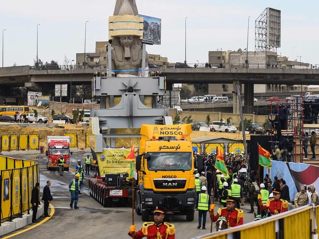 The 3200-year-old colossal statue of King Ramses II during its transfer to the main entrance of the Grand Egyptian Museum in Cairo’s twin city Giza. Picture: AFP Photo/Mohamed El-Shahed