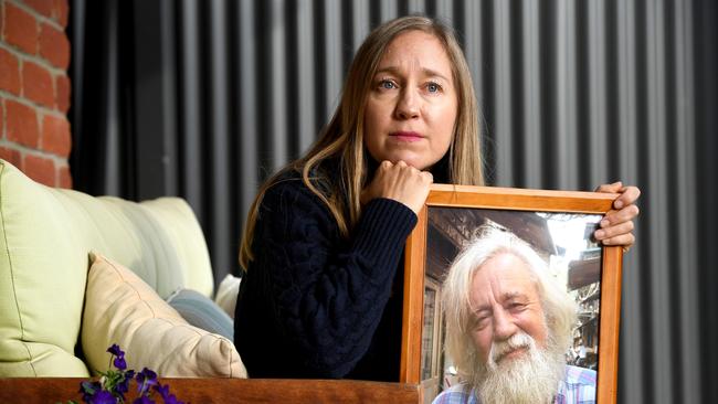 Jasmine Berry with a portrait of her father Ron Selth who died as a result of the Cudlee Creek fire. Picture: Tricia Watkinson